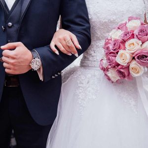Bride and groom arm in arm